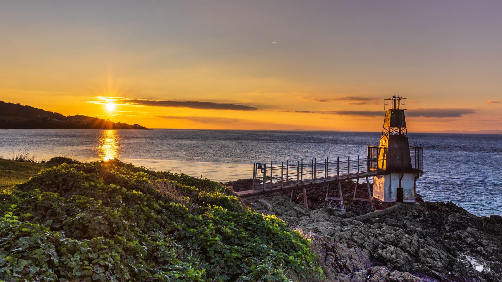 Sunset over the small but very distinctive Portishead Point Lighthouse in North Somerset